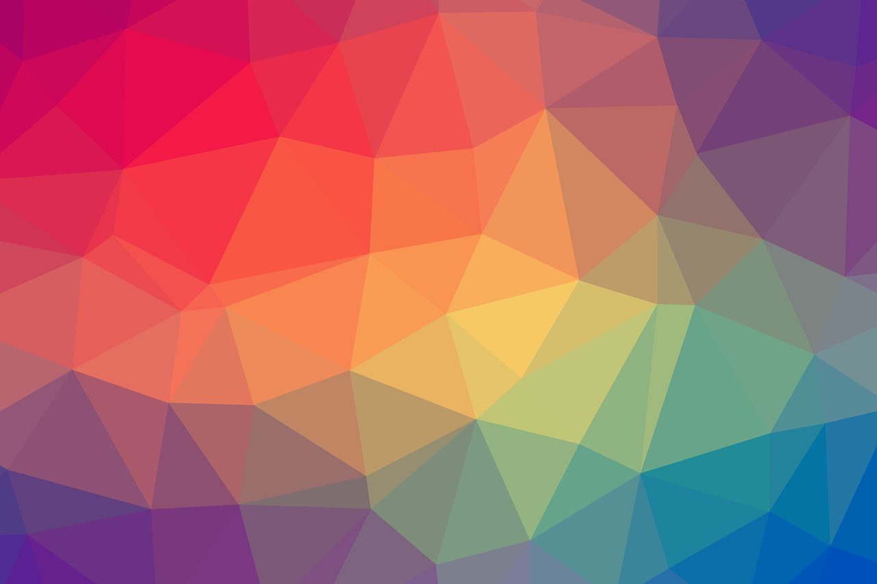 Ein Farbspiel in Regenbogenfarben bestehend aus vielen gemeometrischen Formen aneinander.